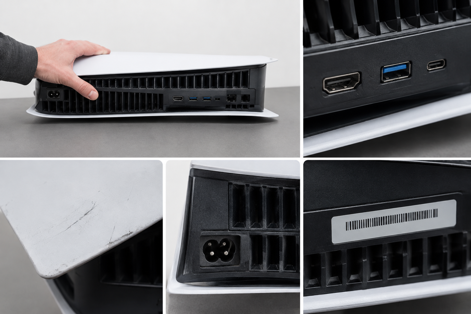 Close-up of console ports, vents and serial sticker area on a grey desk.